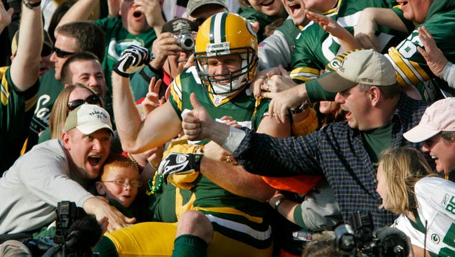 Green Bay Packers #87 Jordy Nelson enjoys the Lambeau Leap after scoring a touchdown in the first half  during a 30-24 win by the Green Bay Packers Sunday, November 22, 2009 at Lambeu Field in Green Bay, Wisconsin. Photo by Rick Wood/RWOOD@JOURNALSENTINEL.COM