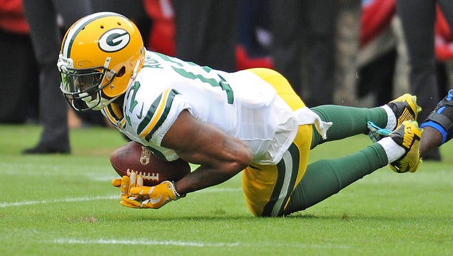 Green Bay Packers wide receiver Davante Adams (17) makes a diving catch at the end of the first half against Carolina Panthers at Bank of America Stadium in Charlotte, N.C.