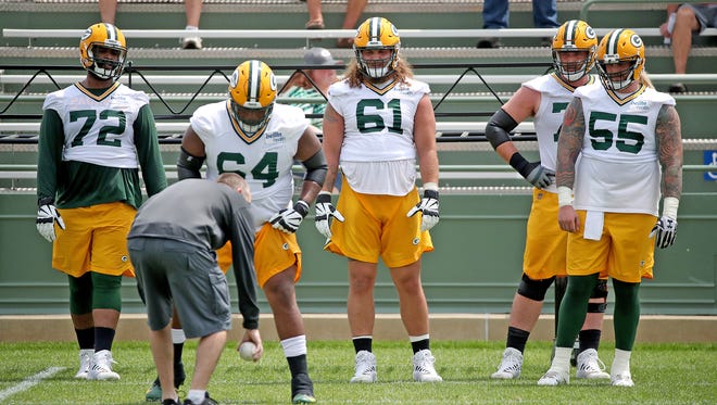 Offensive linemen set up for a drill during Green Bay Packers minicamp at Ray Nitschke Field Tuesday, June 12, 2018 in Ashwaubenon, Wis.