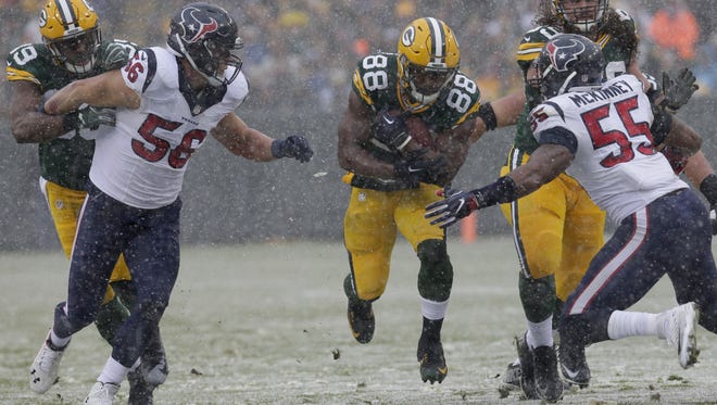 Green Bay Packers wide receiver Ty Montgomery (88) picks up six yards on a run during the second quarter against the Houston Texans on Dec. 4, 2016, at Lambeau Field in Green Bay.