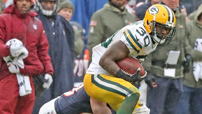 Green Bay Packers running back Jamaal Williams (30) tries to spin out of a tackle against the Chicago Bears on Nov. 12, 2017, at Soldier Field in Chicago.