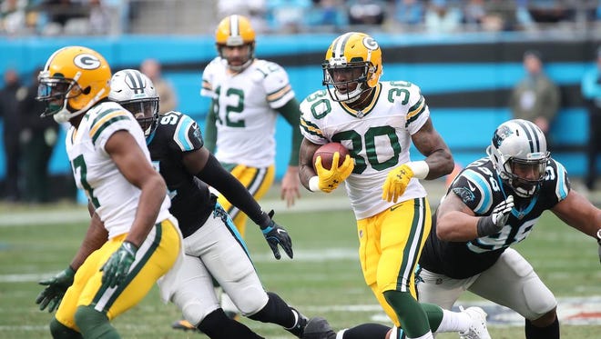 Green Bay Packers running back Jamaal Williams (30) breaks into the secondary against the Carolina Panthers on Sunday, Dec. 17, 2017 at Bank of America Stadium in Charlotte, N.C.