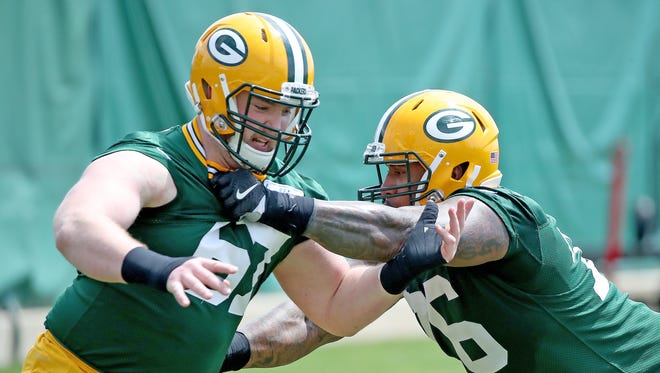 Green Bay Packers defensive end Mike Daniels (76) drills with defensive end Connor Sheehy (67) during Green Bay Packers Organized Team Activities at Ray Nitschke Field Tuesday, May 22, 2018 in Ashwaubenon, Wis