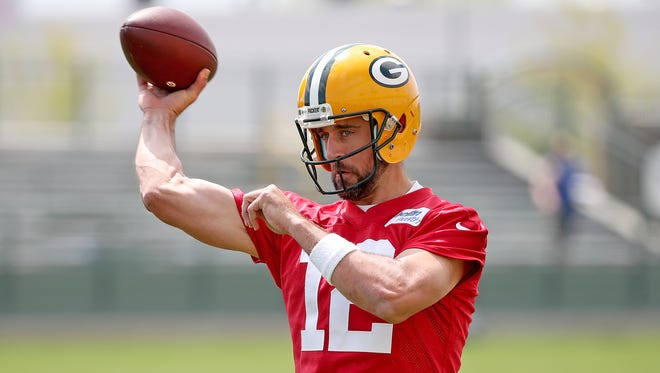 Green Bay Packers quarterback Aaron Rodgers (12) throws during Green Bay Packers Organized Team Activities at Ray Nitschke Field Tuesday, May 22, 2018 in Ashwaubenon, Wis
