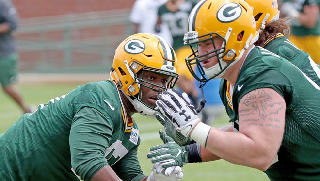 Green Bay Packers nose tackle Kenny Clark (97) blocks during Green Bay Packers minicamp at Ray Nitschke Field Tuesday, June 12, 2018 in Ashwaubenon, Wis.