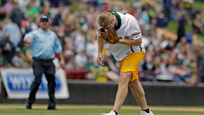 Clay Matthews is hit by a line drive as he pitches during the Green & Gold Charity Softball Game Saturday, June 2, 2018, at Neuroscience Group Field at Fox Cities Stadium in Grand Chute, Wis. The game benefits the Jordy Nelson-backed Young Life organization. The former Packer led the event beginning in 2014.