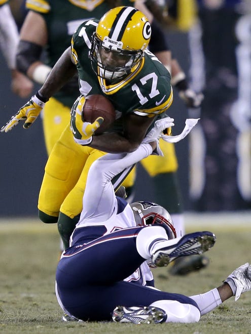 Green Bay Packers' Davante Adams jumps over New England Patriots' Alfonzo Dennard after catching a pass in the third quarter.

The Green Bay Packers host the New England Patriots Sunday, November 30, 2014, at Lambeau Field in Green Bay, Wis. 
Wm.Glasheen/P-C Media