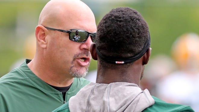 Green Bay Packers defensive coordinator Mike Pettine talks with defensive back Kentrell Brice (29) during Green Bay Packers Training Camp Friday, July 27, 2018 at Ray Nitschke Field in Ashwaubenon, Wis