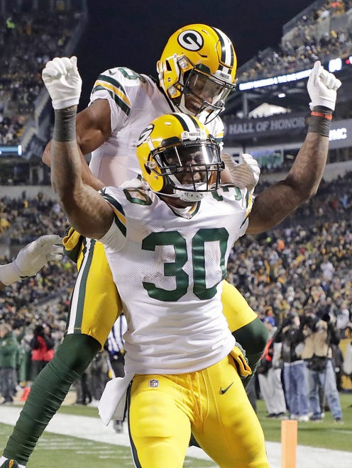Green Bay Packers running back Jamaal Williams (30) celebrates his long touchdown run against the Pittsburgh Steelers on Nov. 26, 2017, at Heinz Field.