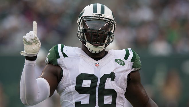 New York Jets defensive end Muhammad Wilkerson (96) celebrates after a blocked pass against the Seattle Seahawks at MetLife Stadium.