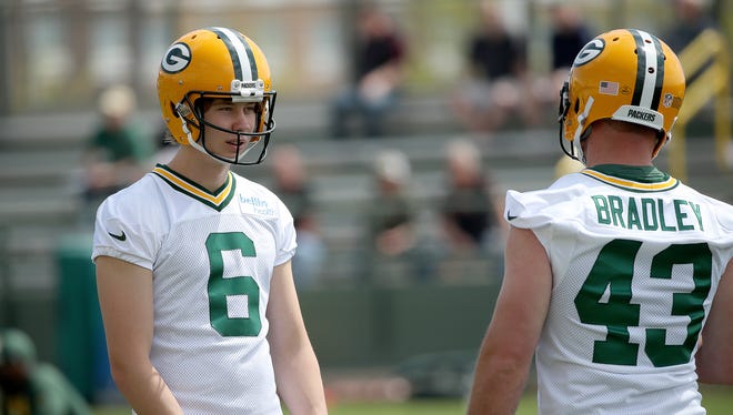 Green Bay Packers punter JK Scott (6) talks with long snapper Hunter Bradley (43) during Green Bay Packers Organized Team Activities at Ray Nitschke Field Tuesday, May 22, 2018 in Ashwaubenon, Wis