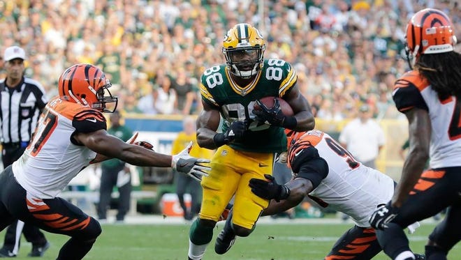 Green Bay Packers running back Ty Montgomery (88) rushes against the Cincinnati Bengals in the third quarter on Sept. 24, 2017, at Lambeau Field in Green Bay.