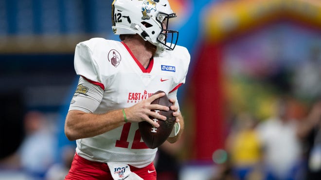 Team East quarterback James Morgan (12) looks to pass during the first quarter against Team West during the East-West Shrine Game on Jan. 18.