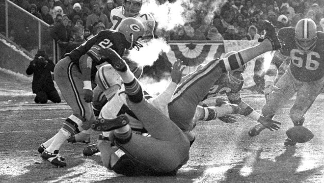 Players spill in all directions after Packers linebacker Lee Roy Caffey forces a fumble by Cowboys quarterback Don Meredith in the third quarter of the 1967 NFL Championship Game on Dec. 31, 1967 at Lambeau Field. Packers defensive back Herb Adderley recovered the ball but Green Bay failed to score off the turnover.