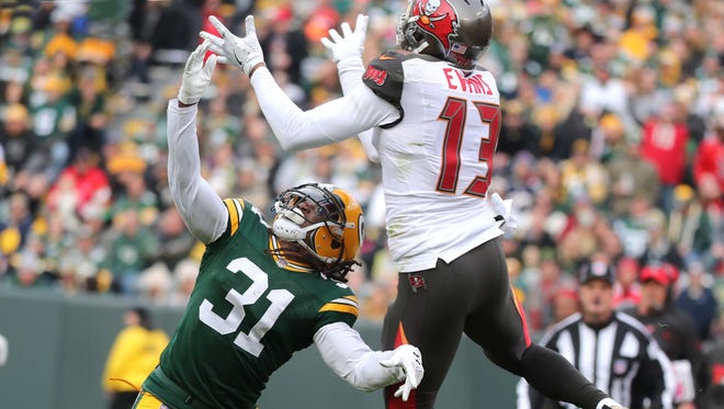Green Bay Packers cornerback Davon House (31) gets in the face of Tampa Bay Buccaneers wide receiver Mike Evans (13) for an incomplete pass on Dec. 3, 2017, at Lambeau Field.