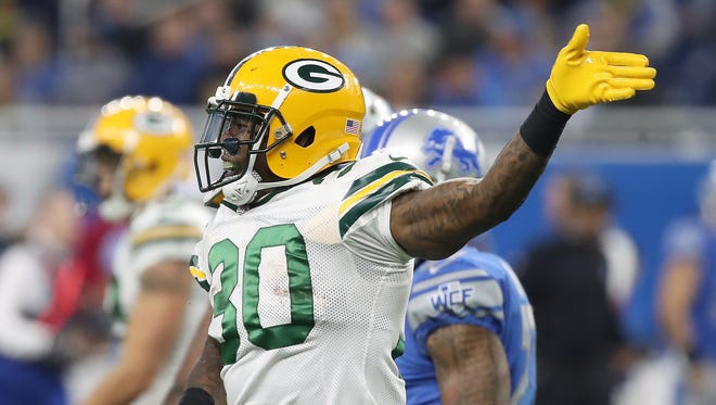 Green Bay Packers running back Jamaal Williams (30) signals a first down against the Detroit Lions on Dec. 31, 2017, at Ford Field.