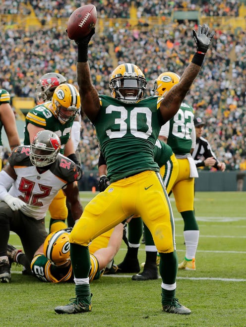Green Bay Packers running back Jamaal Williams (30) celebrates after scoring a touchdown against the Tampa Bay Buccaneers on Dec. 3, 2017, at Lambeau Field.