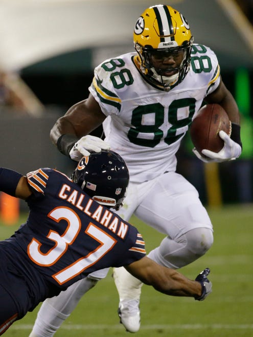 Green Bay Packers running back Ty Montgomery (88) stiff-arms Chicago Bears cornerback Bryce Callahan (37) during the first quarter on Sept. 28, 2017, at Lambeau Field in Green Bay.