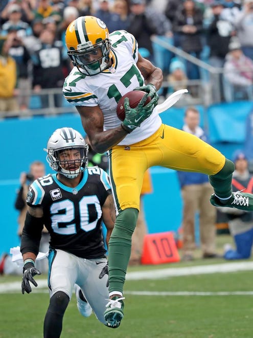 Green Bay Packers wide receiver Davante Adams (17) makes a leaping catch for a touchdown in the first quarter against the Carolina Panthers on Sunday, Dec. 17, 2017 at Bank of America Stadium in Charlotte, N.C.