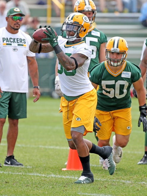 running back Jamaal Williams (30) during a strip drill during Green Bay Packers minicamp at Ray Nitschke Field Tuesday, June 12, 2018 in Ashwaubenon, Wis.