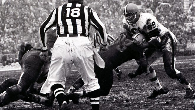 Green Bay Packers guard Fuzzy Thurston (63) blocks Cleveland Browns defensive tackle Jim Kanicki (69) on a run by fullback Jim Taylor during the NFL championship game at Lambeau Field on Jan. 2, 1966. The Packers won 23-12. Press-Gazette archives