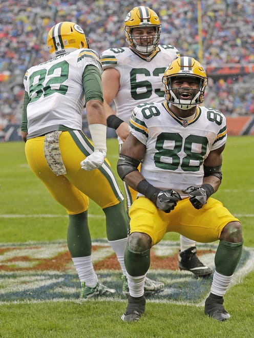 Green Bay Packers running back Ty Montgomery (88) celebrates with center Corey Linsley (63) and tight end Richard Rodgers (82) after his touchdown run against the Chicago Bears on Nov. 12, 2017, at Soldier Field in Chicago.