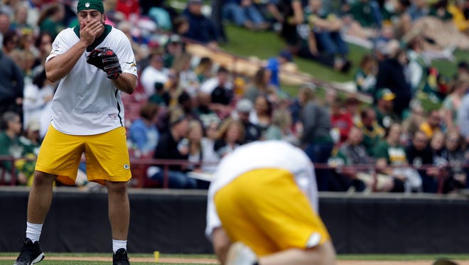 David Bakhtiari reacts as Clay Matthews is hit by a line drive while pitching during the Green & Gold Charity Softball Game Saturday, June 2, 2018, at Neuroscience Group Field at Fox Cities Stadium in Grand Chute, Wis. The game benefits the Jordy Nelson-backed Young Life organization. The former Packer led the event beginning in 2014.