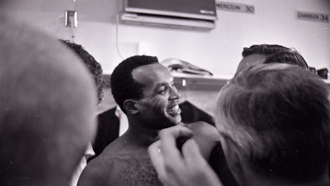 Green Bay Packers cornerback Herb Adderley talks to reporters in the locker room after Super Bowl II at the Orange Bowl in Miami on Jan. 14, 1968. The Packers defeated the Oakland Raiders 33-14.
