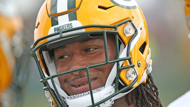 Green Bay Packers running back Aaron Jones (33) smiles during OTAs practice on May 31, 2018, at Ray Nitschke Field.
