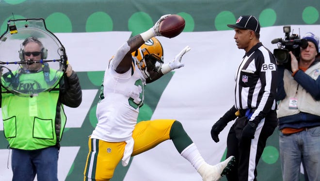 Green Bay Packers' Jamaal Williams (30) celebrates a touchdown during first half of the Green Bay Packers game against the New York Jets at MetLife Stadium Sunday, Dec. 23, 2018, in East Rutherford.