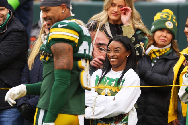 Simone Biles looks on prior to the game between the Minnesota Vikings and Green Bay Packers Sunday at Lambeau Field.