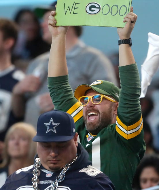 A Green Bay fan celebrates during the fourth quarter of their wild card playoff game Sunday, January 14, 2024 at AT&T Stadium in Arlington, Texas. Green Bay defeated Dallas 48-32.