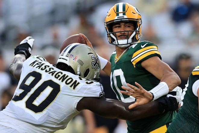 Jordan Love (10) of the Green Bay Packers looks to pass against the New Orleans Saints during the second half at TIAA Bank Field on September 12, 2021, in Jacksonville, Florida.