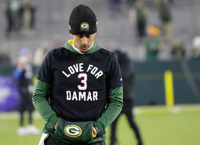 Green Bay Packers quarterback Jordan Love (10) dons a t-shirt supporting the Buffalo Bills’ Damar Hamlin while warming up prior to playing against the Detroit Lions on Jan. 8, 2023, at Lambeau Field in Green Bay, Wis.