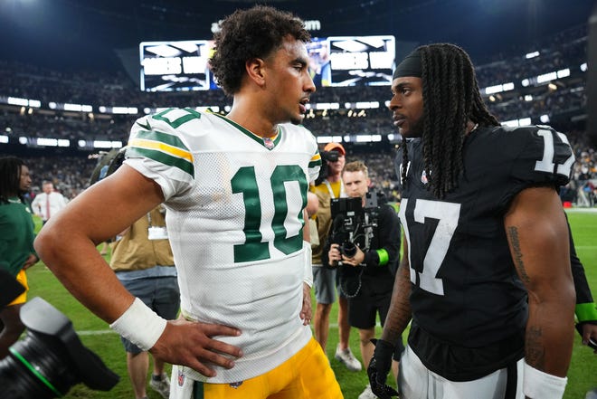 Jordan Love (10) of the Green Bay Packers talks with Davante Adams (17) of the Las Vegas Raiders following the game at Allegiant Stadium on Oct. 09, 2023, in Las Vegas, Nevada.