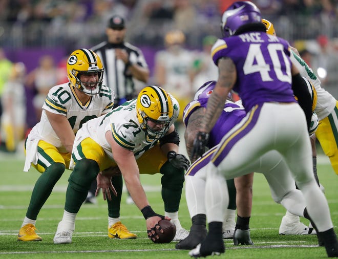 Green Bay Packers quarterback Jordan Love (10) runs the offense against the Minnesota Vikings during their game at U.S. Bank Stadium on Dec. 31, 2023.