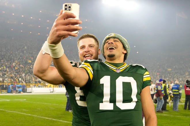 Jordan Love (10) of the Green Bay Packers celebrates with Tucker Kraft (85) of the Green Bay Packers after the game against the Chicago Bears at Lambeau Field on Jan. 07, 2024, in Green Bay, Wisconsin.