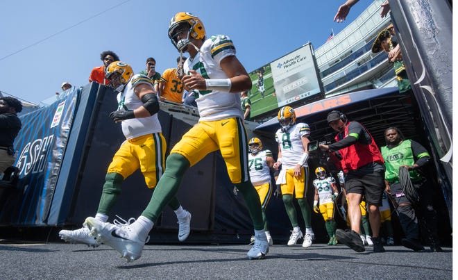 Green Bay Packers quarterback Jordan Love (10) and his teammates trot onto the field before their game against the Chicago Bears Sunday, September 10, 2023 at Soldier Field in Chicago, Ill.