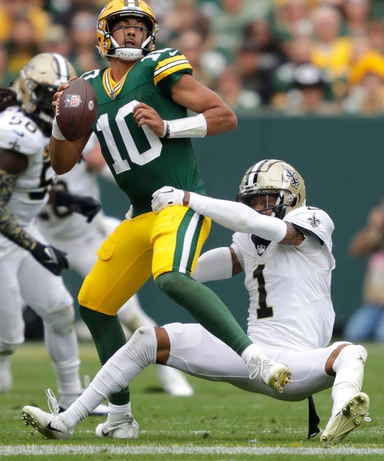 Green Bay Packers quarterback Jordan Love (10) is sacked by New Orleans Saints cornerback Alontae Taylor (1) during their football game Sunday, September 24, 2023, at Lambeau Field in Green Bay, Wis