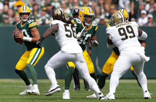 Green Bay Packers quarterback Jordan Love (10) looks to pass against the New Orleans Saints during their football game Sunday, September 24, 2023, at Lambeau Field in Green Bay, Wis.