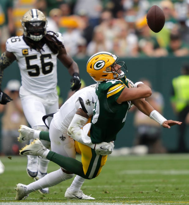 Green Bay Packers quarterback Jordan Love (10) is sacked by New Orleans Saints cornerback Alontae Taylor (1) in the second quarter during their football game Sunday, September 24, 2023, at Lambeau Field in Green Bay, Wis.