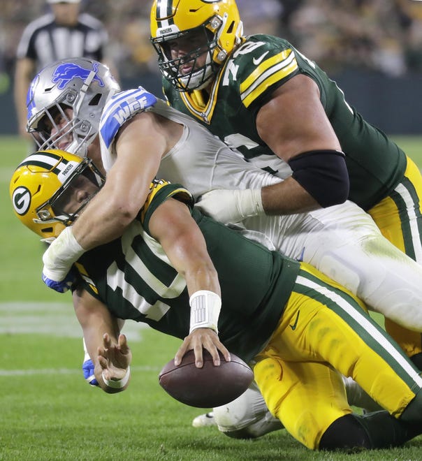 Packers guard Jon Runyan blocks while Lions defensive lineman Aidan Hutchinson tackles Packers quarterback Jordan Love short of the goal line on a two-point conversion attempt during the Lions' 34-20 win on Thursday, Sept. 28, 2023, in Green Bay, Wisconsin.