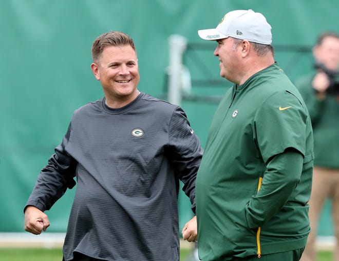 Packers general manager Brian Gutekunst and head coach Mike McCarthy talk during practice on Clarke Hinkle Field Thursday, September 27, 2018 in Ashwaubenon, Wis