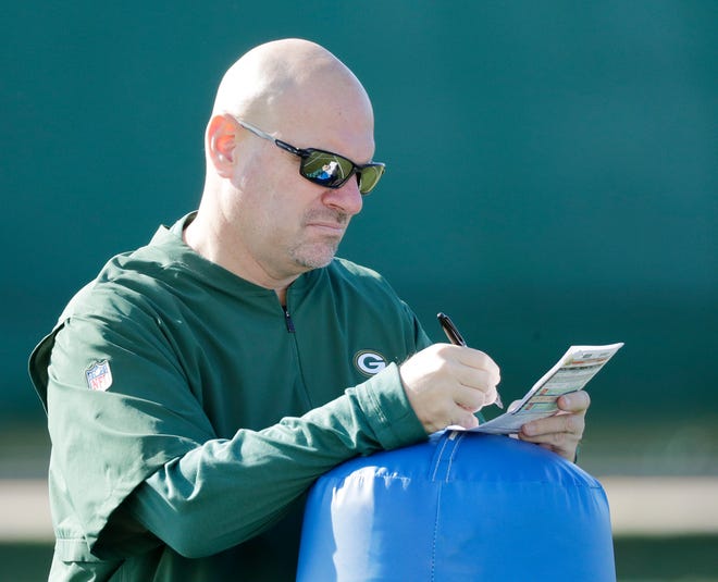 Green Bay Packers defensive coordinator Mike Pettine takes notes during practice at Ray Nitschke Field on Wednesday, October 31, 2018 in Ashwaubenon, Wis.