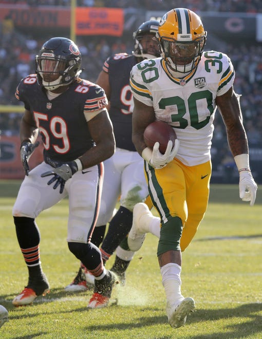 Green Bay Packers running back Jamaal Williams (30) scores a touchdown on a 10-yard run during the third  quarter of their game against the Chicago Bears Sunday, December 25, 2018 at Soldier Field in Chicago, Ill. The Chicago Bears beat the Green Bay Packers 24-17.

MARK HOFFMAN/MILWAUKEE JOURNAL SENTINEL