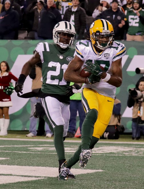Green Bay Packers' Davante Adams catches the game winning catch past New York Jets' Morris Claiborne during overtime of the of the Green Bay Packers 44-38 win against the New York Jets at MetLife Stadium Sunday, Dec. 23, 2018, in East Rutherford.