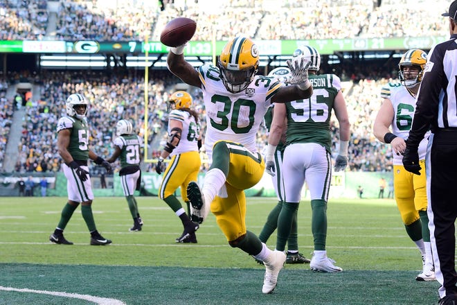 Jamaal Williams of the Green Bay Packers celebrates after scoring a touchdown against the New York Jets during the second quarter at MetLife Stadium on December 23, 2018 in East Rutherford, New Jersey.  (Photo by Steven Ryan/Getty Images)