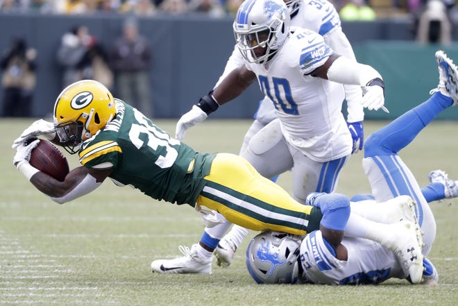 Green Bay Packers running back Jamaal Williams (30) stretches for extra yards in the first quarter against the Detroit Lions at Lambeau Field on Sunday, December 30, 2018 in Green Bay, Wis.
Adam Wesley/USA TODAY NETWORK-Wis