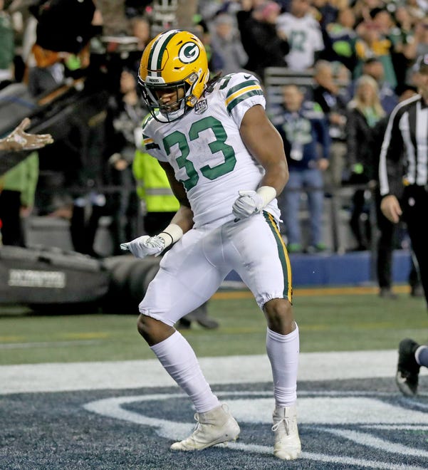 Green Bay Packers running back Aaron Jones (33) celebrates a touchdown run against the Seattle Seahawks at CenturyLink Field Thursday, November 15, 2018 in Seattle, WA. Jim Matthews/USA TODAY NETWORK-Wis