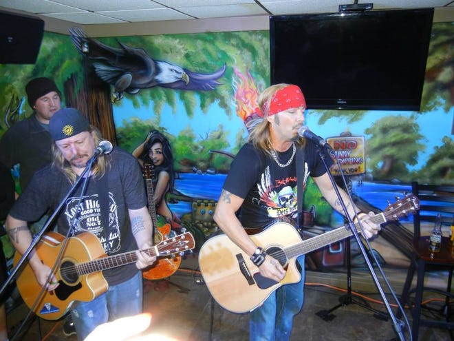 Bret Michaels, with accompaniment from guitarist Pete Evick, left, plays a private show for about 100 lucky invitees in 2014 at The Sand Box in Green Bay.